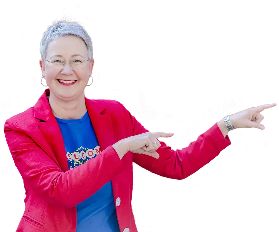Susanne Jestel, Marketing Mentorin und kreative Kampagnen-Designerin aus Berlin, trägt einem roten Blazer und zeigt lächeln mit beiden Händen auf den Text "Marketing einfach machen – frische Ideen, Struktur und ein klarer Plan für dein Marketing. Alles, um dein Angebot mit passenden Kund:innen zusammenzubringen."